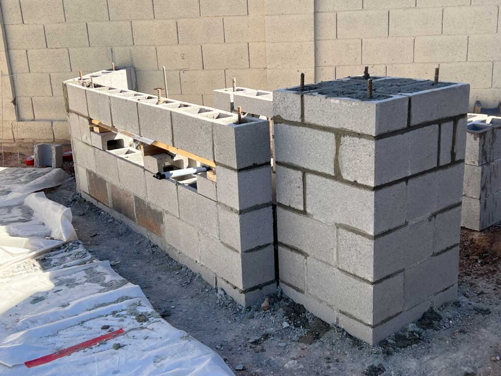 Complete reference about concrete masonry units: nominal vs. actual sizes, block weight, types, grout and rebar, and how CMU walls are built to last in Arizona.