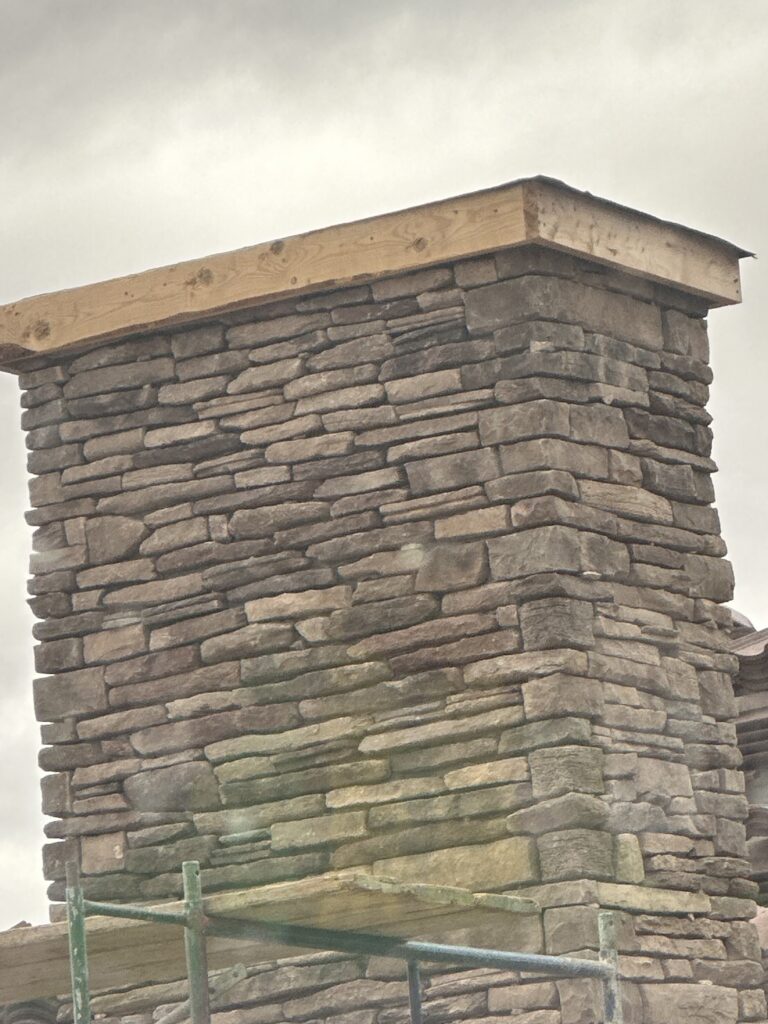 Learn how stone and brick veneer is installed in Arizona, natural vs. manufactured stone, and the moisture details that help it last.